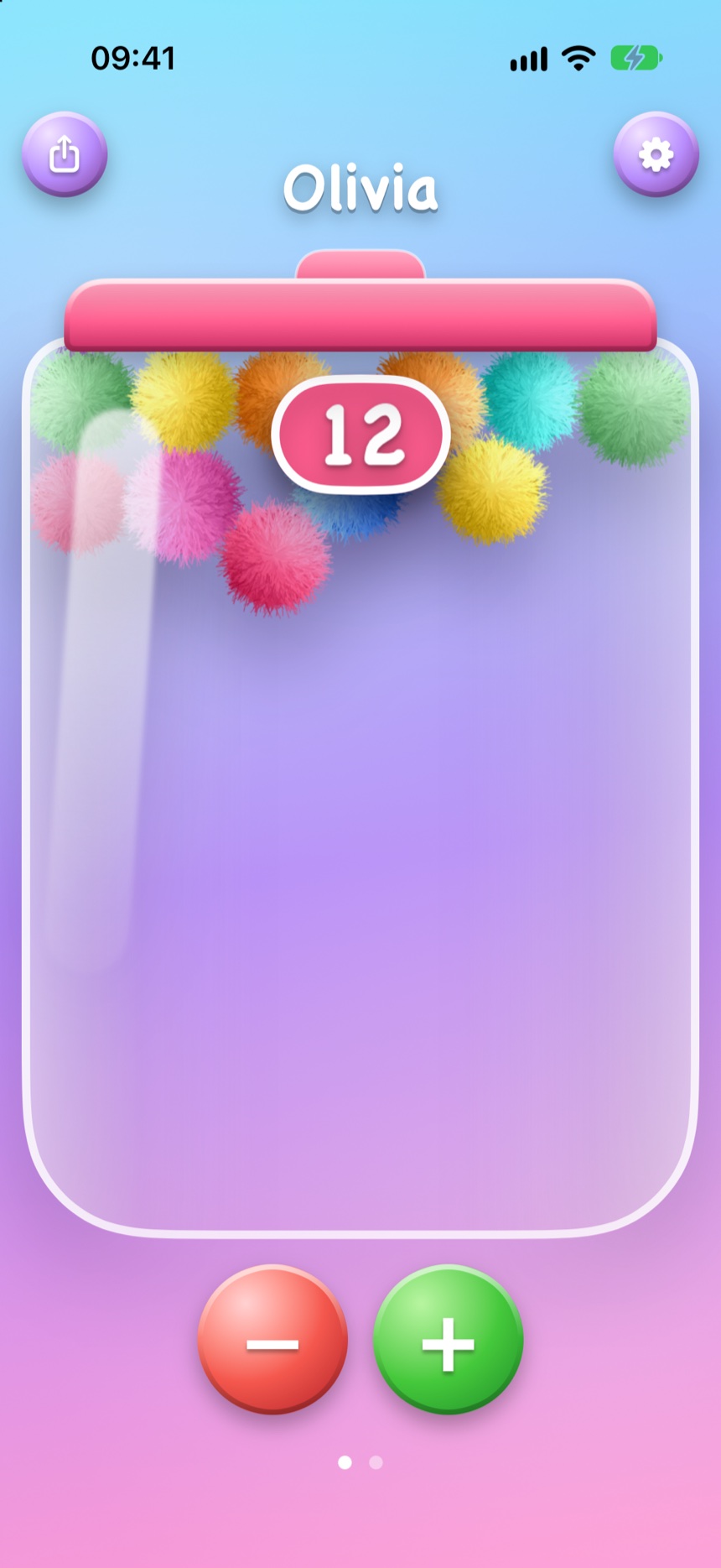 Phone upside down with pompoms piled against the lid
